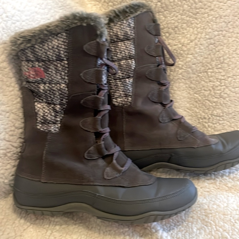 The North Face Woman’s fur lined waterproof snow boots.